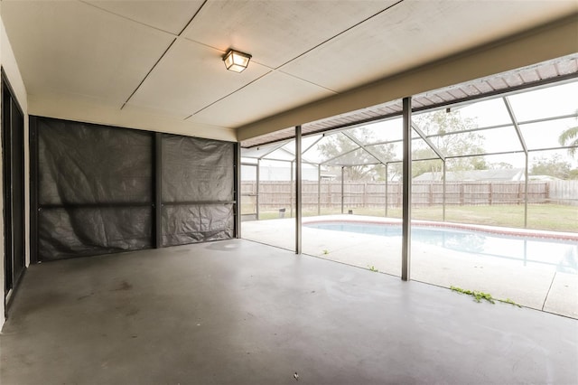 unfurnished sunroom with plenty of natural light