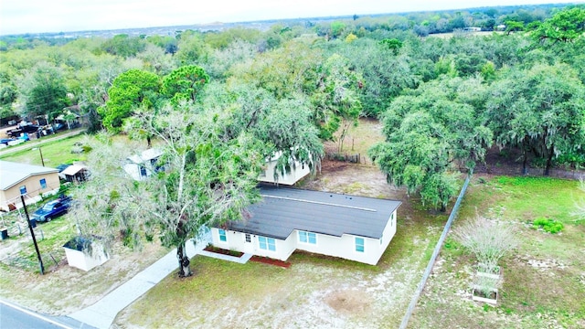 aerial view featuring a view of trees