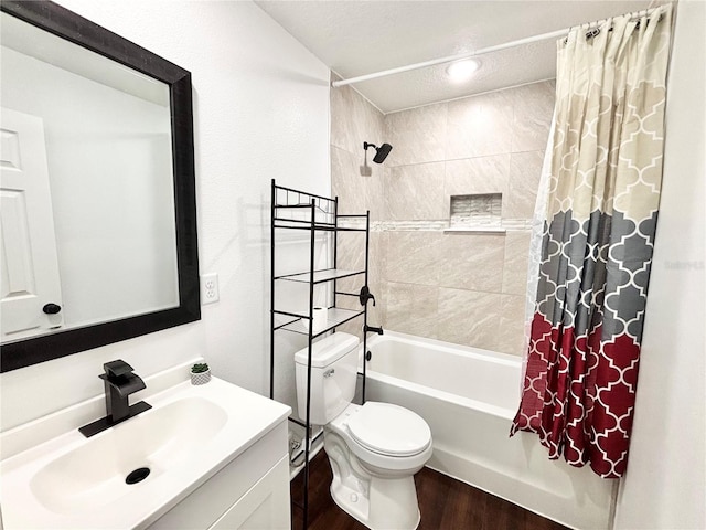 bathroom featuring vanity, wood finished floors, toilet, and shower / tub combo with curtain