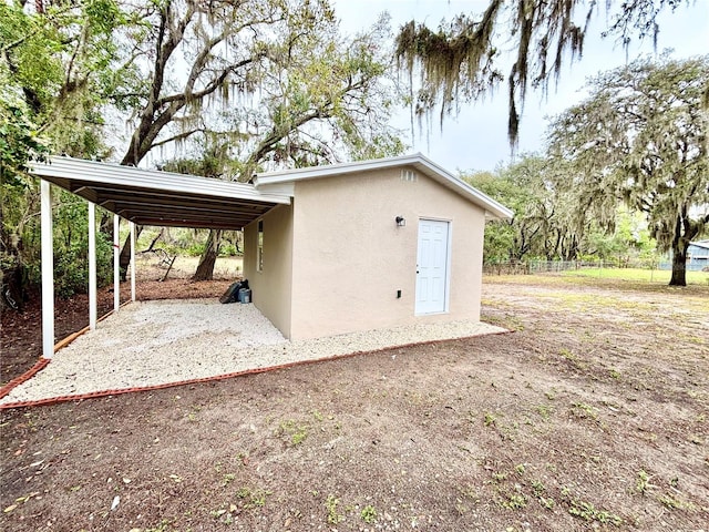 view of outbuilding featuring a carport