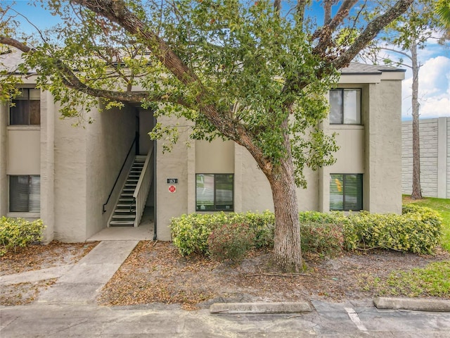 view of property featuring stairway