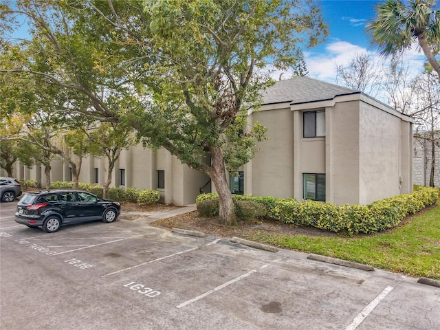 view of property with uncovered parking