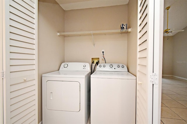 laundry room with light tile patterned floors, ceiling fan, laundry area, separate washer and dryer, and baseboards