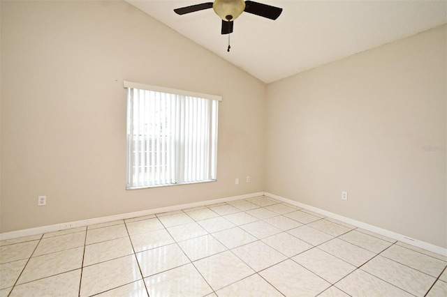 spare room featuring vaulted ceiling, baseboards, and ceiling fan