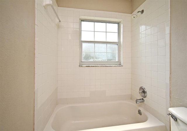 full bathroom featuring toilet and washtub / shower combination