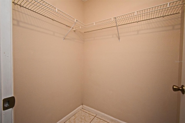 walk in closet featuring tile patterned floors