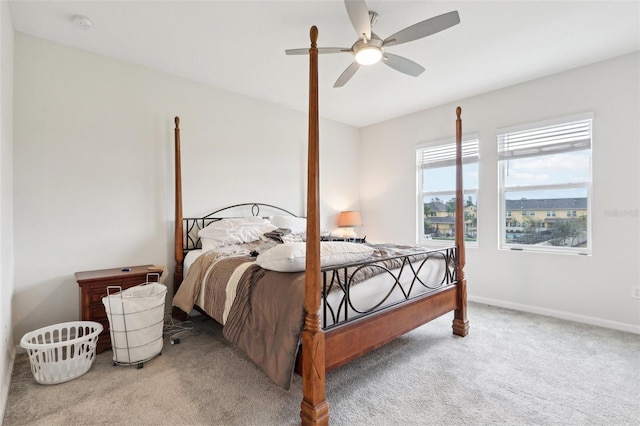 bedroom featuring carpet floors, a ceiling fan, and baseboards