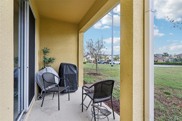 exterior space featuring a residential view and a grill