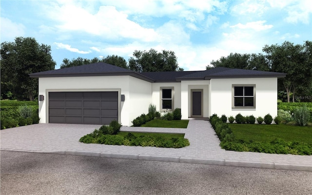 view of front of house with decorative driveway, stucco siding, an attached garage, and a front yard