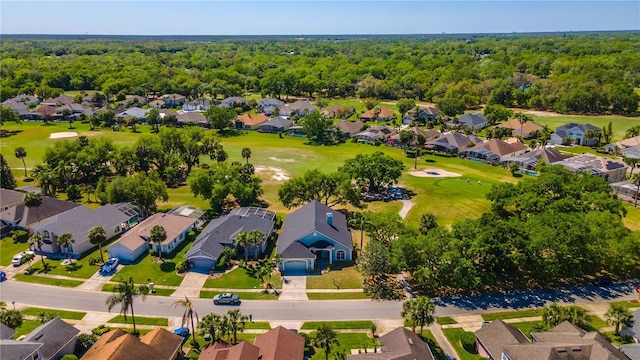 bird's eye view with golf course view, a forest view, and a residential view