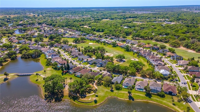 bird's eye view with a residential view and a water view