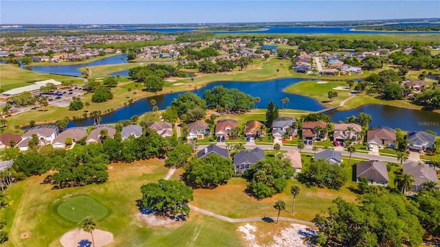 aerial view featuring golf course view, a water view, and a residential view