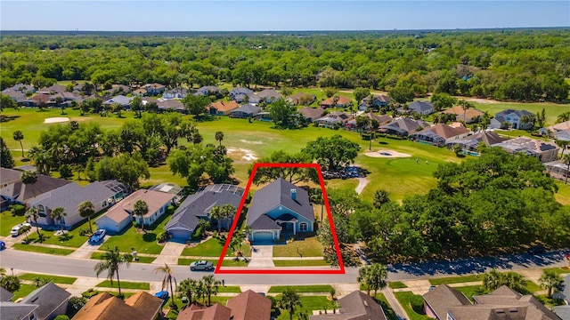 aerial view featuring a residential view, golf course view, and a forest view