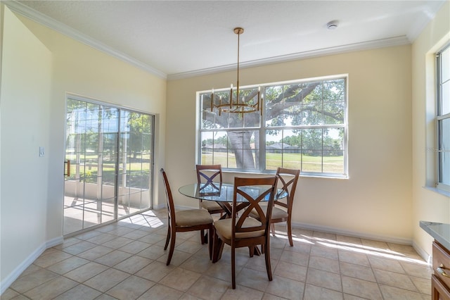 dining space with baseboards, a notable chandelier, light tile patterned flooring, and crown molding