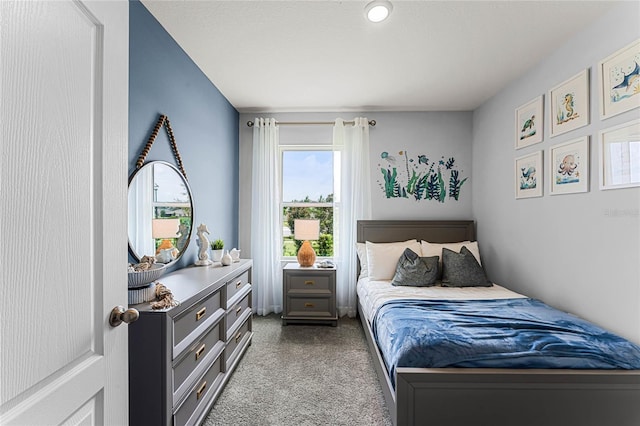 bedroom featuring light colored carpet