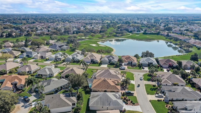 drone / aerial view with a residential view and a water view