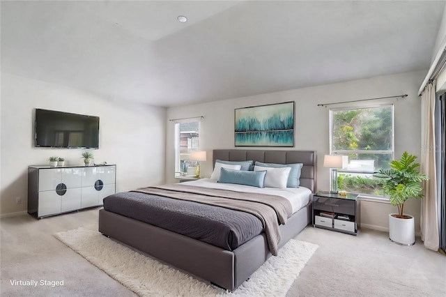 bedroom featuring baseboards and carpet flooring