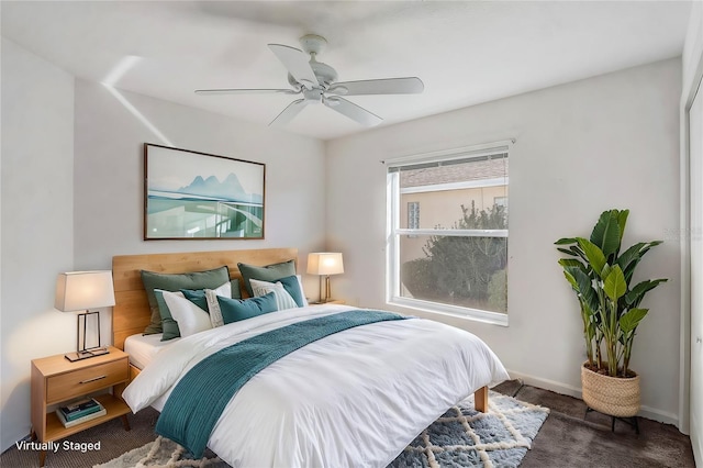 bedroom featuring ceiling fan, carpet flooring, and baseboards