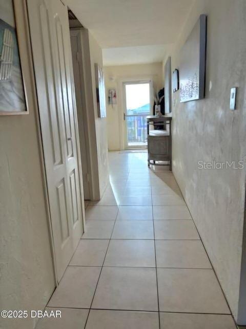 corridor with light tile patterned floors