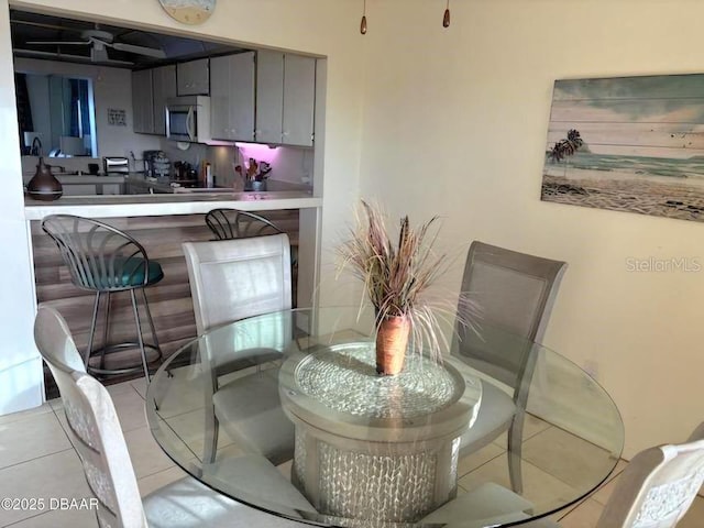 dining space with light tile patterned floors