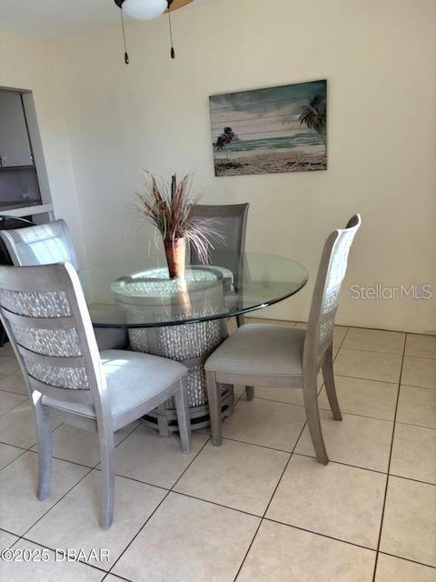 dining area with light tile patterned flooring