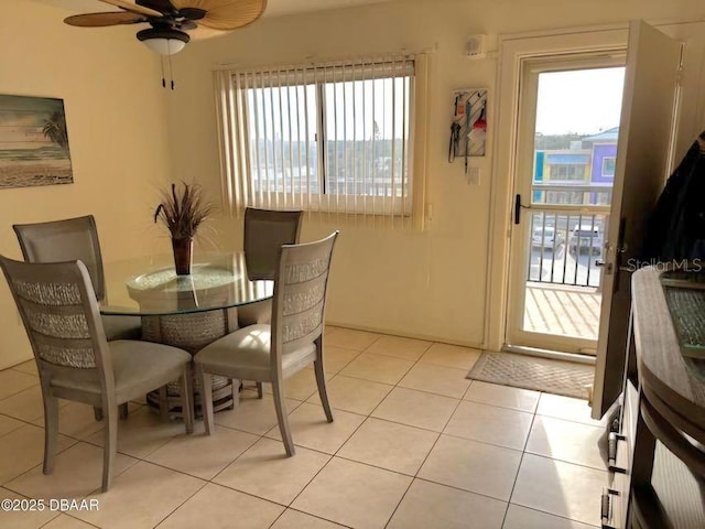 dining area featuring a wealth of natural light, ceiling fan, and light tile patterned floors