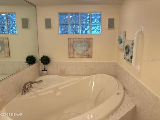 bathroom with tiled bath