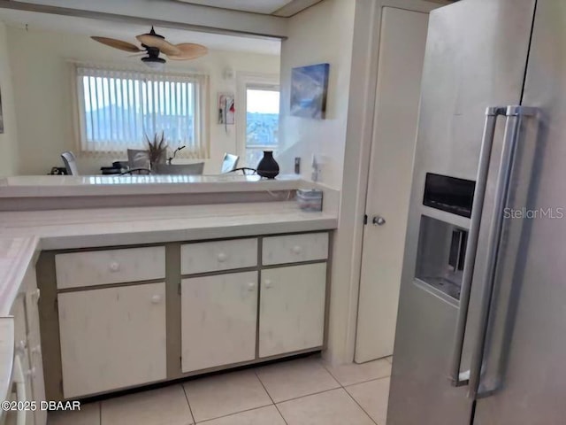 kitchen with light countertops, ceiling fan, high end refrigerator, and light tile patterned flooring