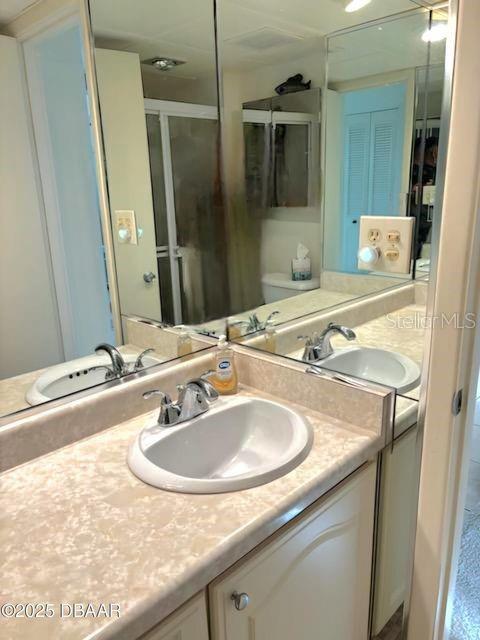 full bath with toilet and vanity