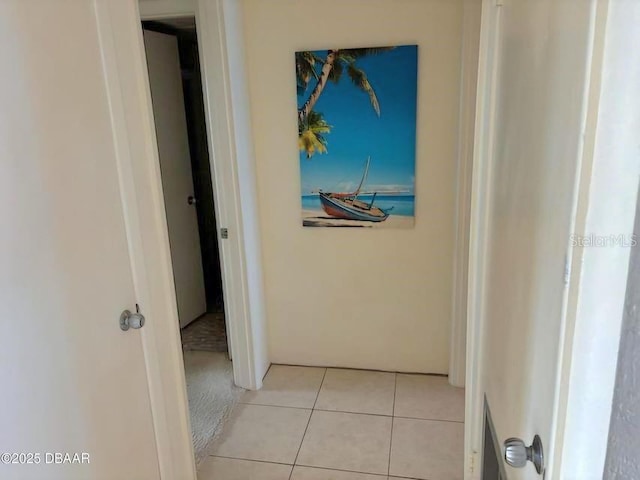 hall with light tile patterned flooring