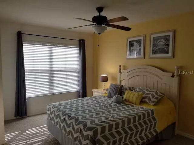 carpeted bedroom with a ceiling fan