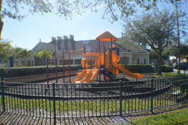 community jungle gym featuring fence