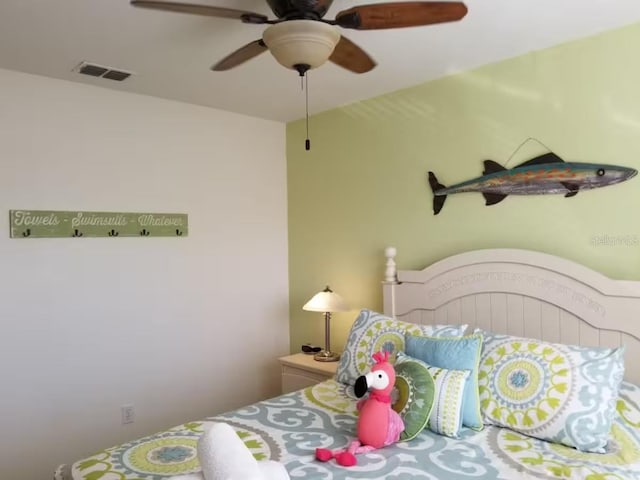 bedroom with visible vents and a ceiling fan