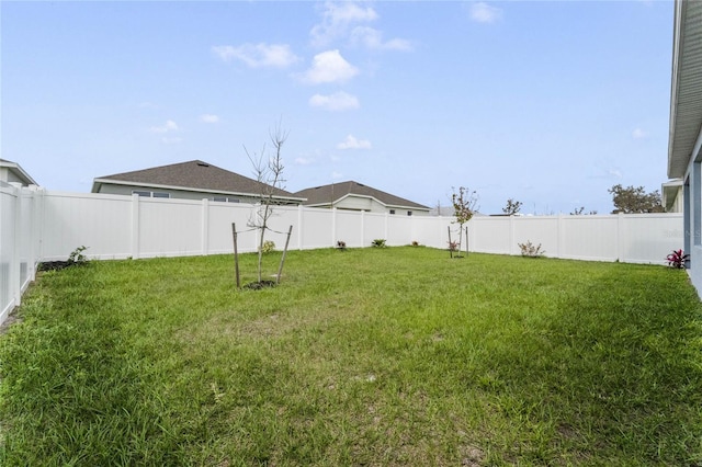 view of yard featuring a fenced backyard