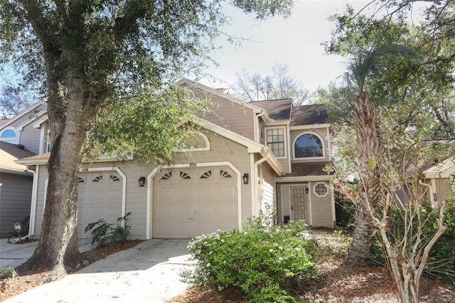 view of front facade with a garage and concrete driveway