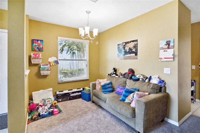 playroom with light colored carpet, baseboards, and an inviting chandelier