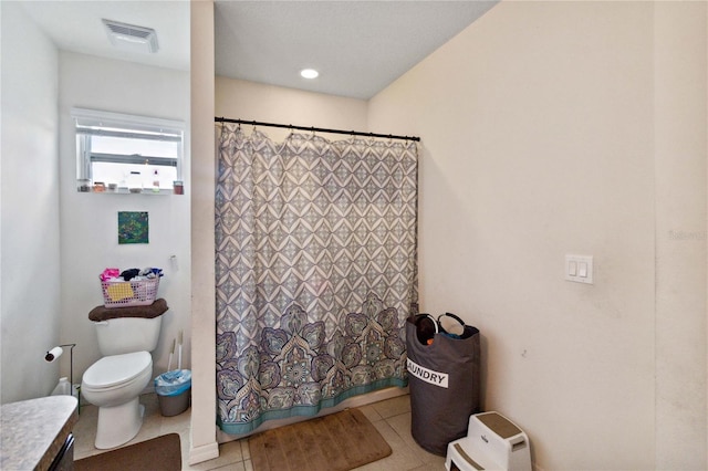 bathroom featuring toilet, visible vents, and a shower with shower curtain