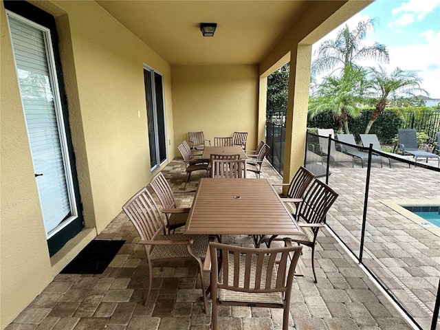 view of patio / terrace featuring outdoor dining space and fence