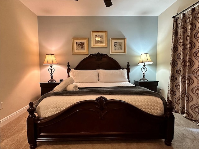 bedroom featuring a ceiling fan, carpet flooring, and baseboards