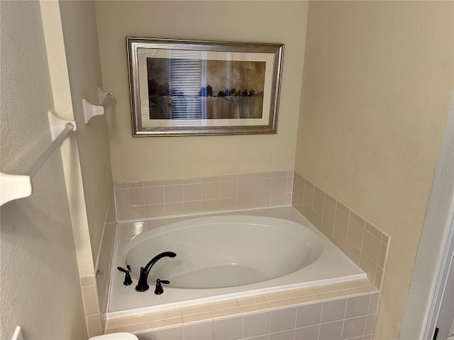 bathroom with a garden tub