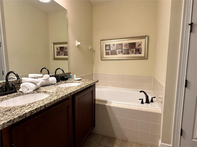 full bathroom featuring double vanity, tile patterned flooring, a sink, and a bath