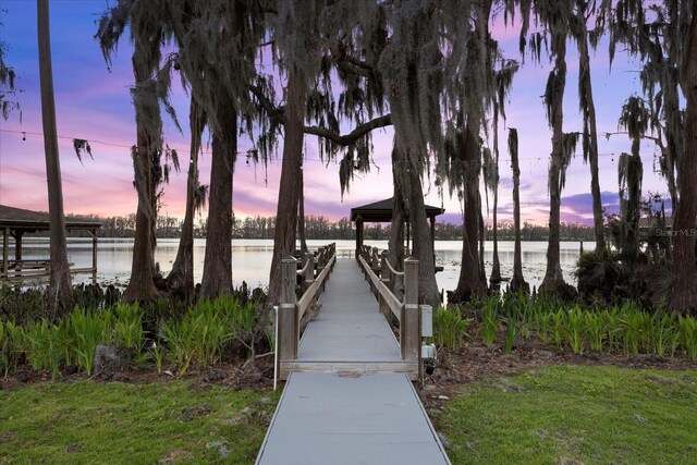 dock area featuring a gazebo and a water view