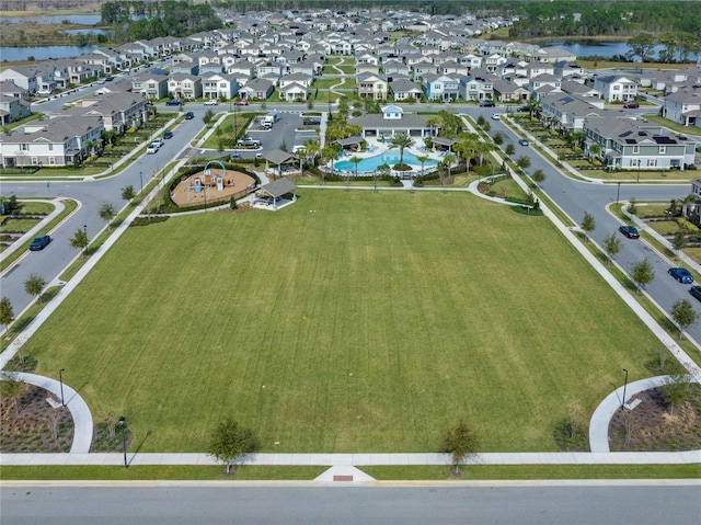 aerial view featuring a residential view and a water view