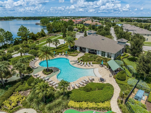 community pool featuring a patio and a water view