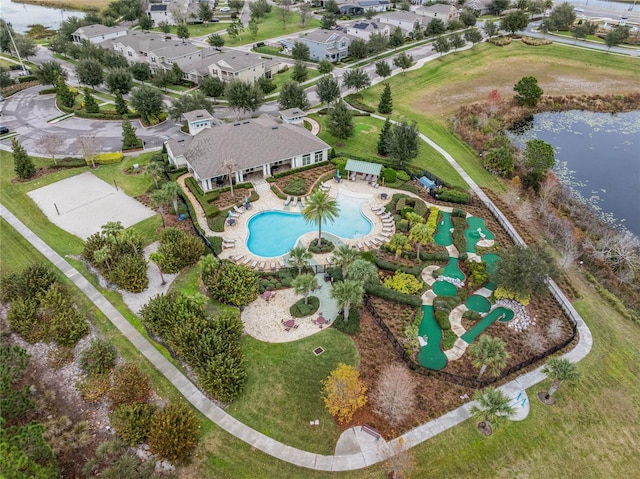 drone / aerial view featuring a water view and a residential view