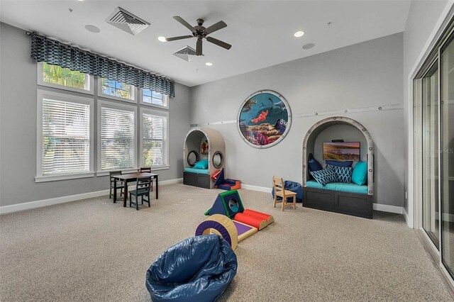 rec room featuring visible vents, baseboards, ceiling fan, carpet, and recessed lighting