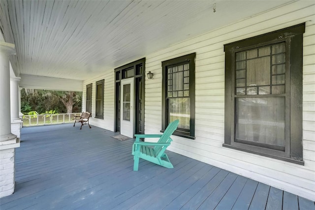 wooden deck featuring covered porch