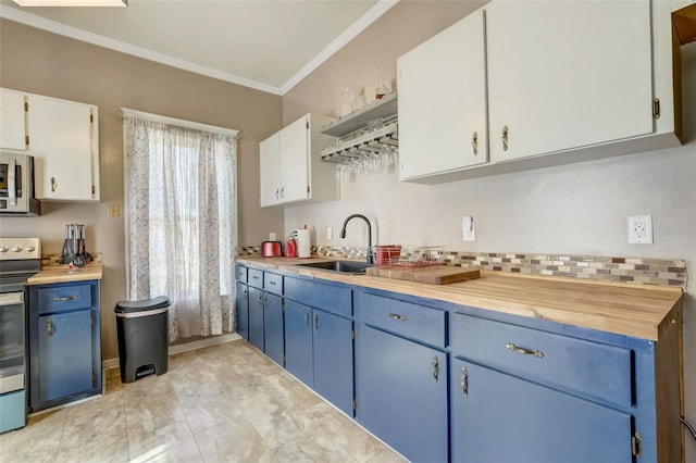 kitchen featuring ornamental molding, light countertops, blue cabinetry, and stainless steel electric range