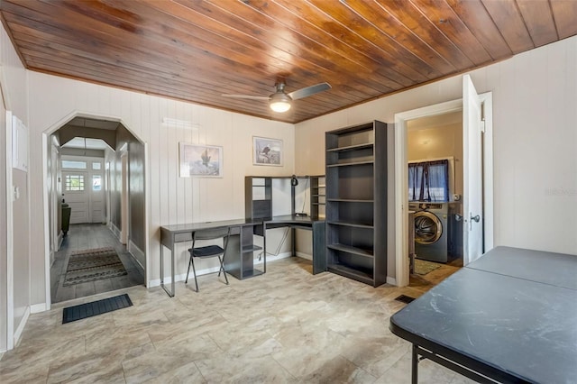 office area featuring visible vents, arched walkways, a ceiling fan, wood ceiling, and washer / clothes dryer