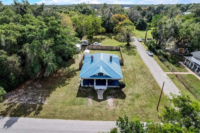 birds eye view of property with a wooded view